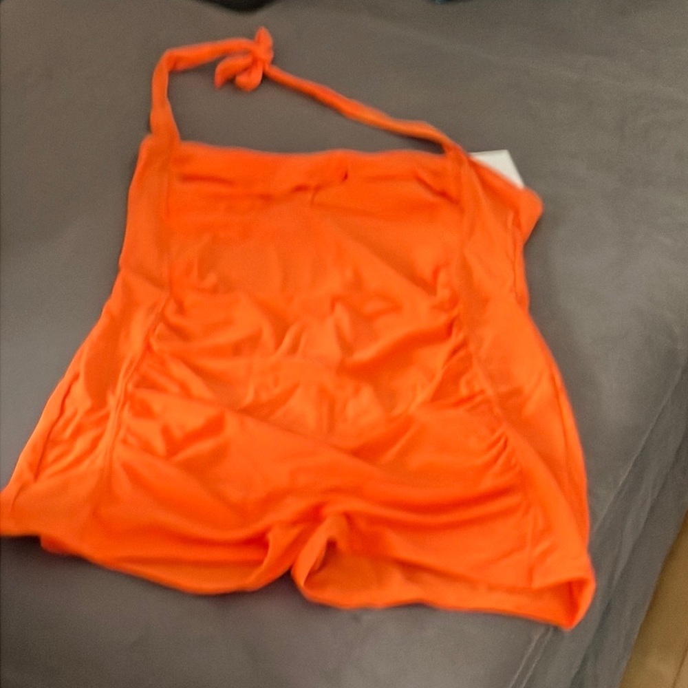 Bright orange halter swimsuit one piece with shorts cut